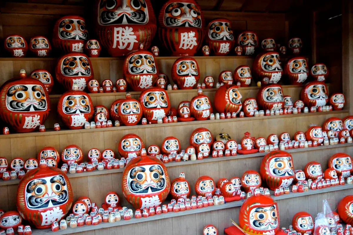 Red daruma dolls at Katsuo-ji in Minoh on a Katsuo-ji, Arashiyama and Kinkaku-ji day tour from Kyoto